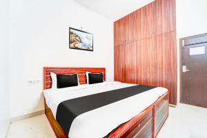 Postel nebo postele na pokoji v ubytování Super Hotel O Aarapalayam + 24 fotografií