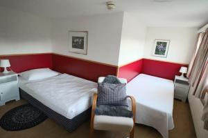 Postel nebo postele na pokoji v ubytování Hotel am Schönenbühl