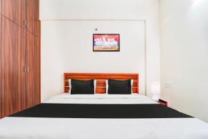 Postel nebo postele na pokoji v ubytování Super Hotel O Aarapalayam