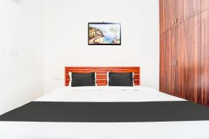 Postel nebo postele na pokoji v ubytování Super Hotel O Aarapalayam