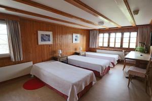 Postel nebo postele na pokoji v ubytování Hotel am Schönenbühl