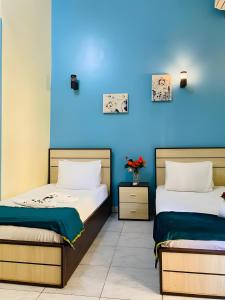 Voodi või voodid majutusasutuse Hostgram Hotel in cairo toas