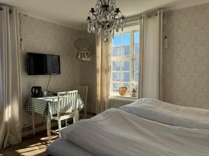 Voodi või voodid majutusasutuse Hotell Vaxblekaregården toas