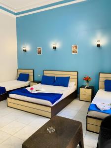 Voodi või voodid majutusasutuse Hostgram Hotel in cairo toas