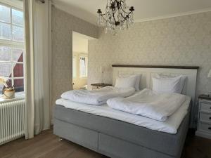 Voodi või voodid majutusasutuse Hotell Vaxblekaregården toas