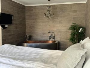 Voodi või voodid majutusasutuse Hotell Vaxblekaregården toas