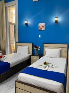 Voodi või voodid majutusasutuse Hostgram Hotel in cairo toas