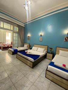 Voodi või voodid majutusasutuse Hostgram Hotel in cairo toas
