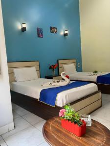 Voodi või voodid majutusasutuse Hostgram Hotel in cairo toas