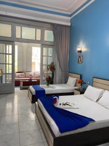 Voodi või voodid majutusasutuse Hostgram Hotel in cairo toas