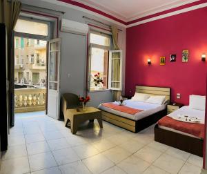Voodi või voodid majutusasutuse Hostgram Hotel in cairo toas