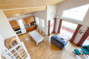 an overhead view of a living room with a couch and a table at Polden, house by Ramberg Beach in Ramberg