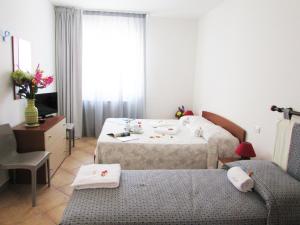 Postel nebo postele na pokoji v ubytování B&B Monelli