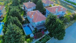 an overhead view of a house with a swimming pool at The One Alacatı in Çeşme