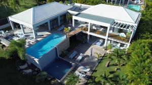 an overhead view of a house with a swimming pool at Villa Azurela in Sainte-Anne