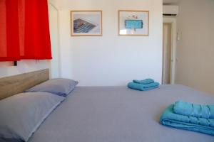 Łóżko lub łóżka w pokoju w obiekcie Apartment Calle Larga