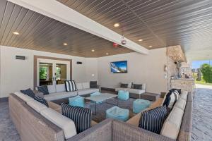 a large living room with couches and a fireplace at Majesty Estate in Salt Lake with Private Pool and Sport Court in Draper