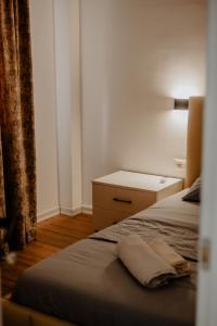 Postel nebo postele na pokoji v ubytování Hotel Suite Dolce Vita