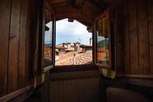 an open window with a view of a city at Comodità a due passi dal lago in Verbania