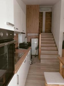 Kuchyň nebo kuchyňský kout v ubytování Apartman BARONI