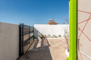 a gate on the side of a building at Monoshez in Benoni