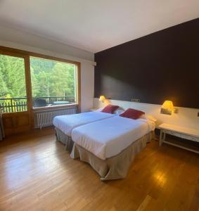 Postel nebo postele na pokoji v ubytování Hotel Els Avets