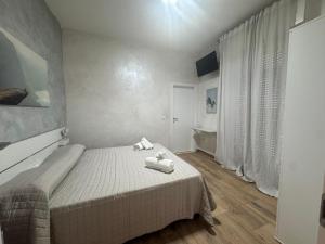 Postel nebo postele na pokoji v ubytování Hotel Eriale Nuova Gestione