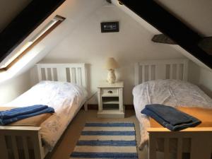 Ένα ή περισσότερα κρεβάτια σε δωμάτιο στο The Cottage, High Street Staithes