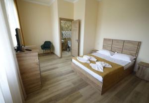 Letto o letti in una camera di ANGINE Resort Hotel