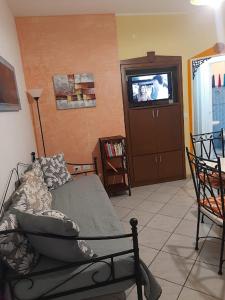 TV a/nebo společenská místnost v ubytování Conchiglie 7