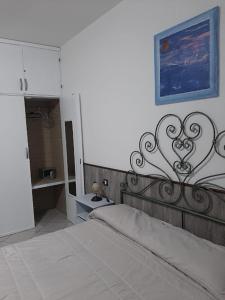 Postel nebo postele na pokoji v ubytování Conchiglie 7 + 9 fotografií