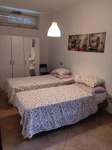 Ένα ή περισσότερα κρεβάτια σε δωμάτιο στο Villa Andrea B&B
