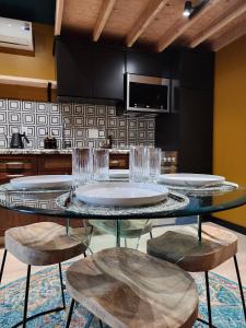 a kitchen with a table with plates and glasses on it at Events Allowed: Sunny Villa| Lake| Trails| Beach in La Mesa