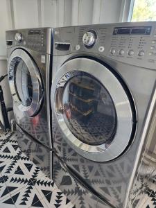 a washing machine is sitting in a room at Events Allowed: Sunny Villa| Lake| Trails| Beach in La Mesa