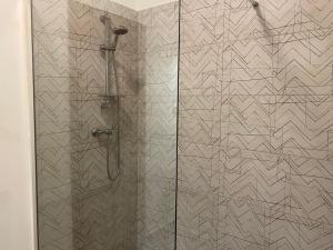 a shower stall with a glass door with a shower at Dragica in Valbandon +36 photos