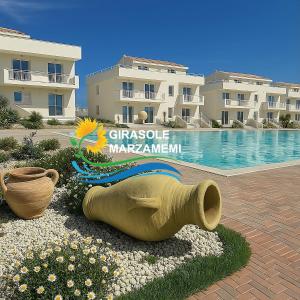 Photo de la galerie de l'établissement Marzamemi - Appartamento Girasole al Resort Borgo 84, à Marzamemi