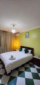 Postel nebo postele na pokoji v ubytování Malabata Prime Location - Boulevard View Apt