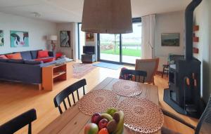 a dining room and living room with a table with fruit on it at Stunning Home In Lemmer With Wifi in Lemmer