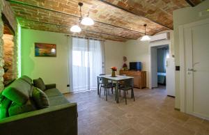a living room with a couch and a table at Antica Cluviae in Palombaro