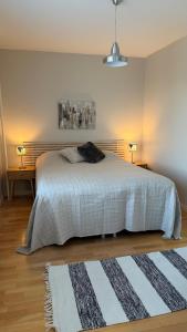 Ένα ή περισσότερα κρεβάτια σε δωμάτιο στο Apartment Pilvenveikko