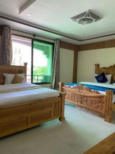 Postel nebo postele na pokoji v ubytování Arcadian Resort Skardu