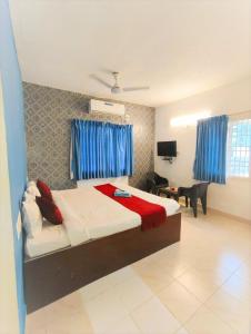 Ένα ή περισσότερα κρεβάτια σε δωμάτιο στο KK Beach View Residency