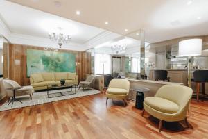 Uma área de estar em Bourbon Hotel & Suites Curitiba