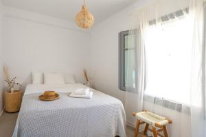 Ένα ή περισσότερα κρεβάτια σε δωμάτιο στο Relaxia Estate Naxos By KB Hospitality