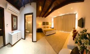 Postel nebo postele na pokoji v ubytování Charme Pousada Boutique & Spa