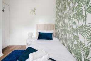 Ένα ή περισσότερα κρεβάτια σε δωμάτιο στο Modern 2 Bedroom House with Parking