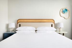 Postel nebo postele na pokoji v ubytování Verdanza Hotel