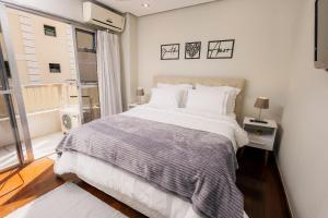 Giường trong phòng chung tại Parque Prime - Em frente ao Parque das Águas (!) +97 ảnh