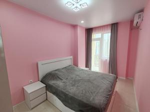 Ένα ή περισσότερα κρεβάτια σε δωμάτιο στο Меликишвили 40