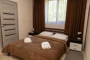 Postel nebo postele na pokoji v ubytování Guest House Sofia